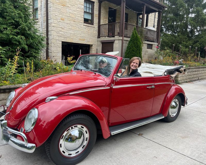Red Volkswagen Beetle convertible delivered to its owner