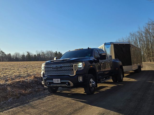 The Denali and an enclosed trailer at sunrise, March 2026