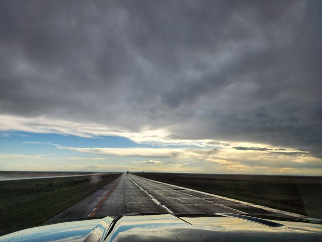 Wet highway across the plains after a storm, May 2023